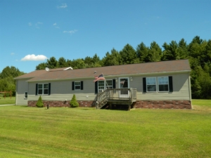 What are some companies that buy manufactured homes?